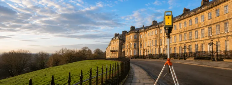 Trimble X9 3D laser scanner surveying a historic period building