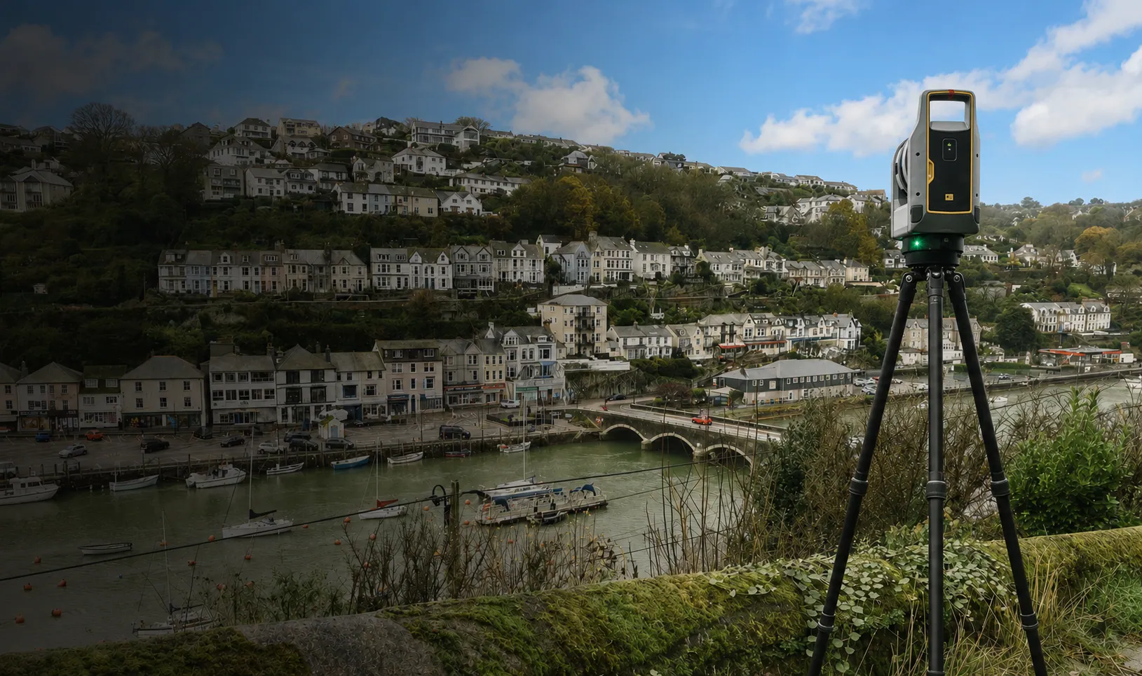 Trimble X9 3D laser scanner overlooking Looe Harbour, used by Pinpoint Mapping for land and measured building surveys