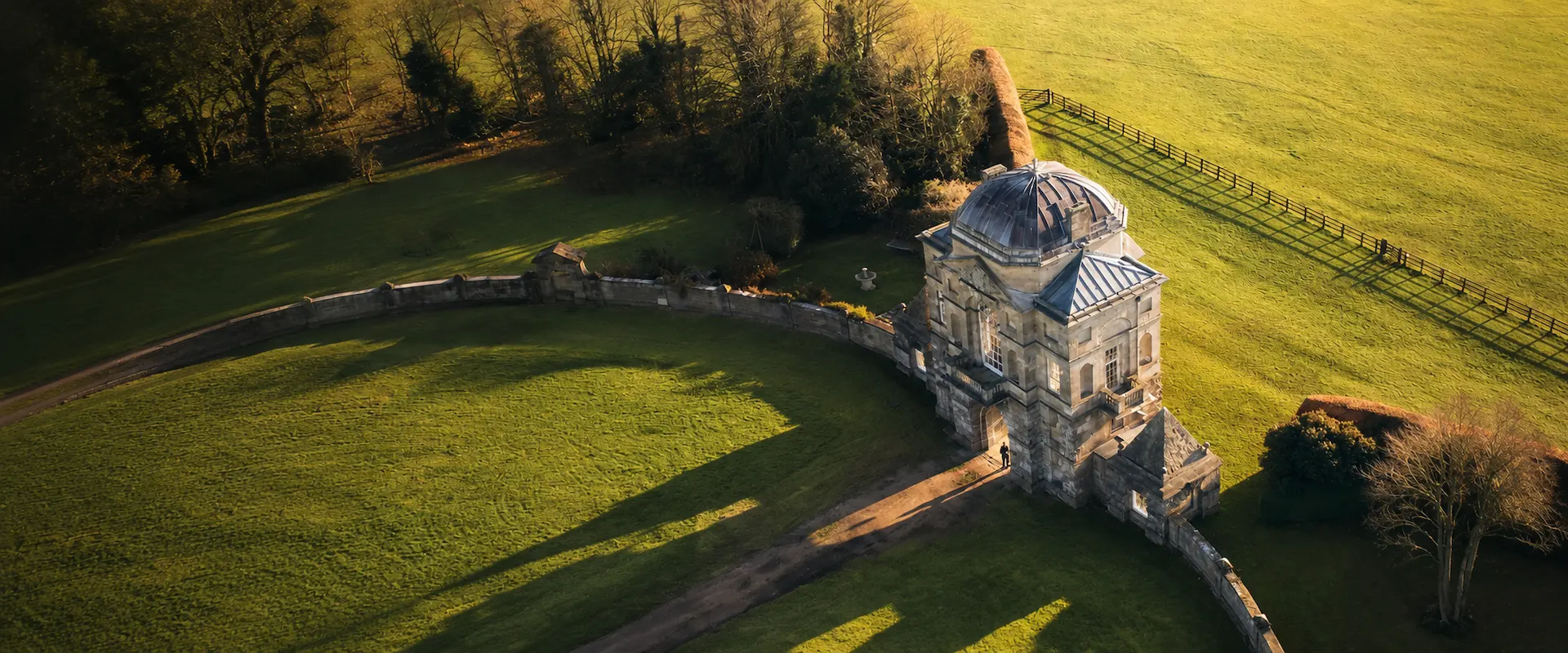 Contact Pinpoint Mapping for measured survey services – aerial view of a historic gatehouse and surrounding estate grounds