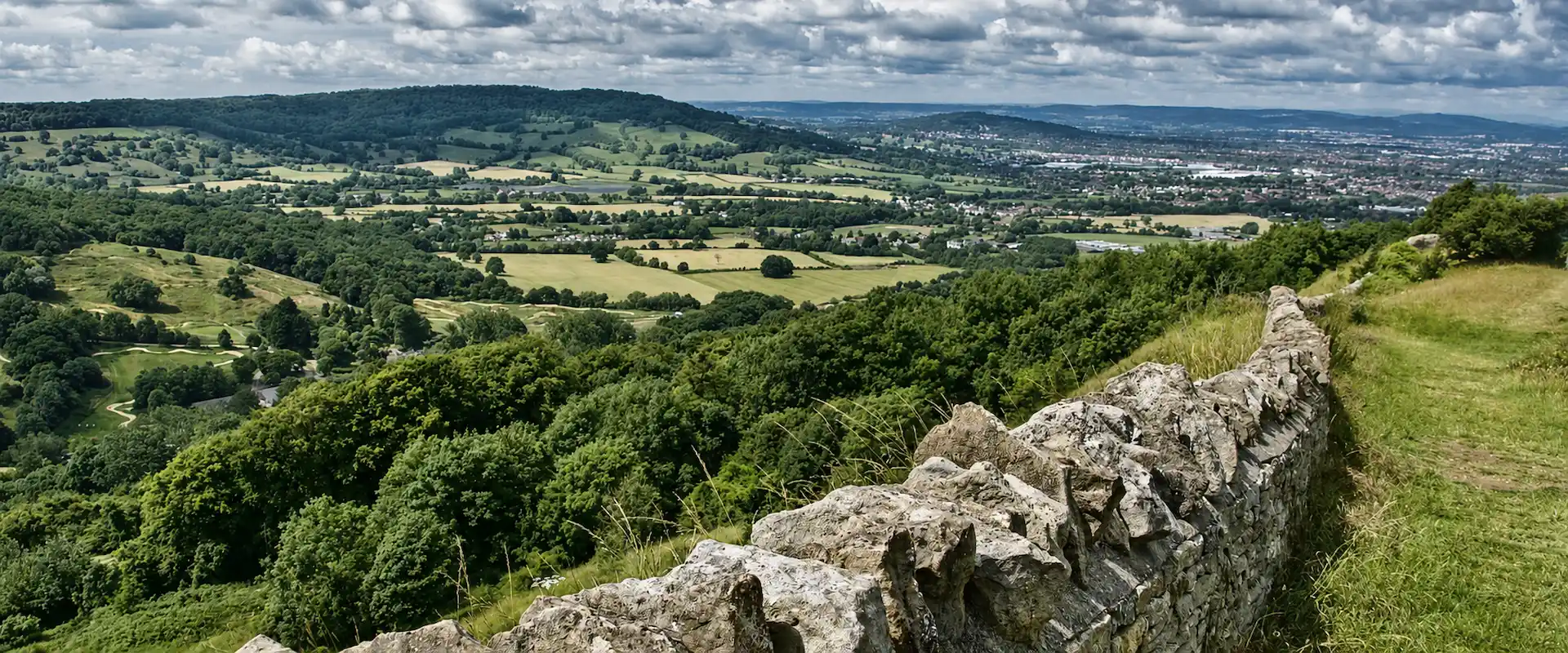 Land Surveys Cotswolds overlooking the Cotswold countryside and traditional stone wall