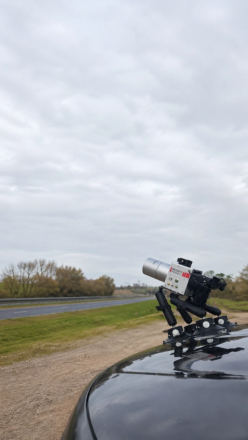 Mobile Mapping Surveys vehicle-mounted LiDAR system beside a UK highway corridor